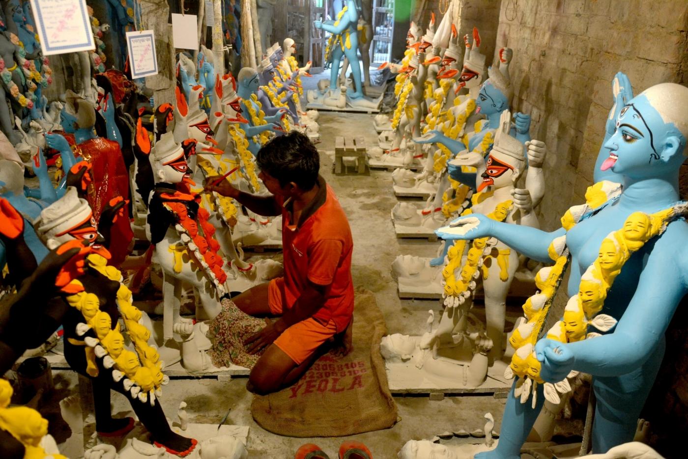 Kolkata: An artist busy painting an idol of Goddess Kali at a Kumartoli workshop ahead of Kali Puja, in Kolkata on Oct 28, 2018. (Photo: Kuntal Chakrabarty/IANS) by .
