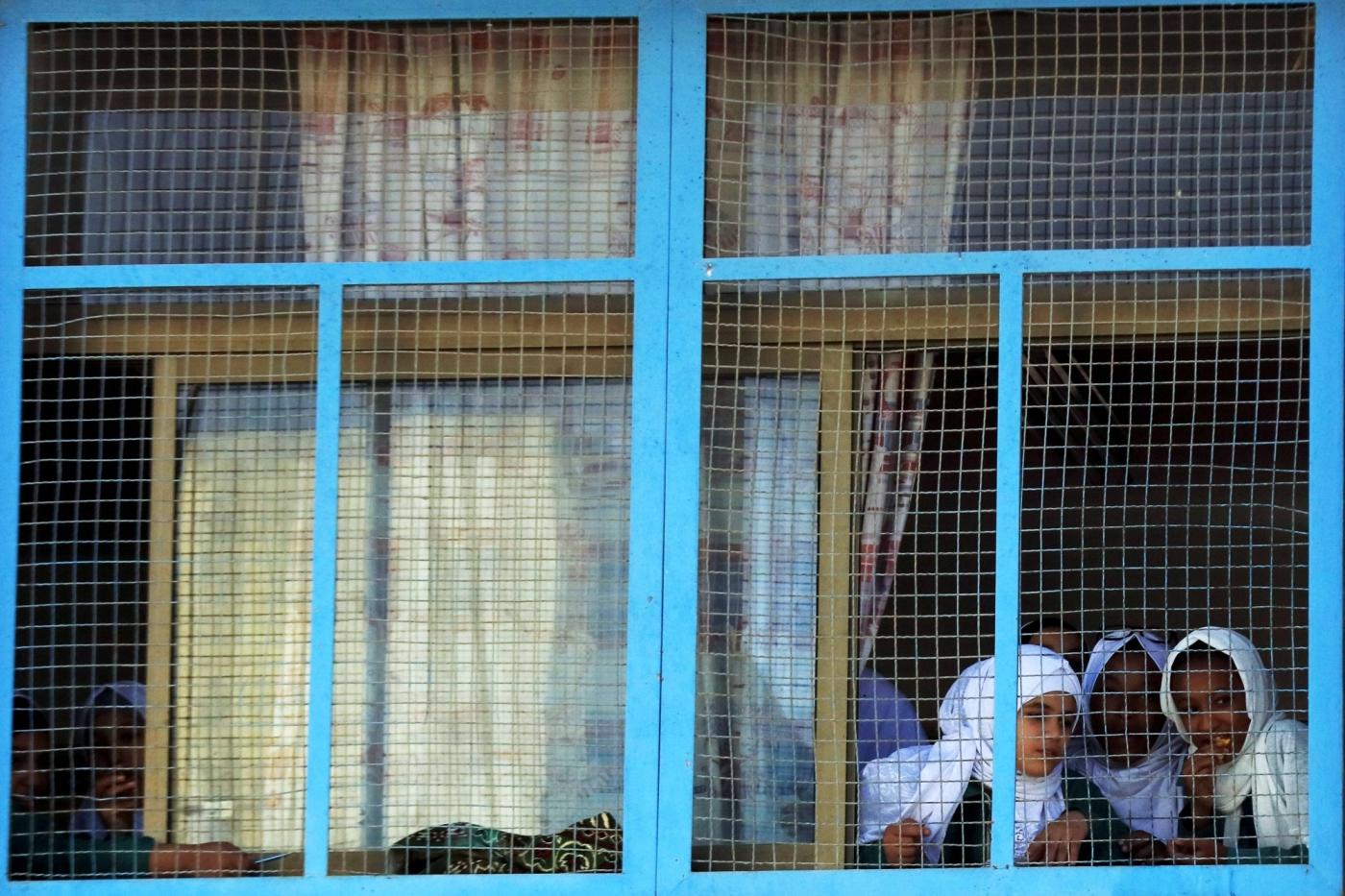AMMAN, Oct. 17, 2018 (Xinhua) -- Palestinian refugee students look out of the window at a school of Baqa'a Palestinian refugee camp in Amman, Jordan, on Oct. 16, 2018. (Xinhua/Mohammad Abu Ghosh/IANS) by .