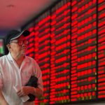 An investor in the trading hall of a Chinese securities firm in Nanjing, China. (File Photo: Xinhua/Su Yang/IANS) by .