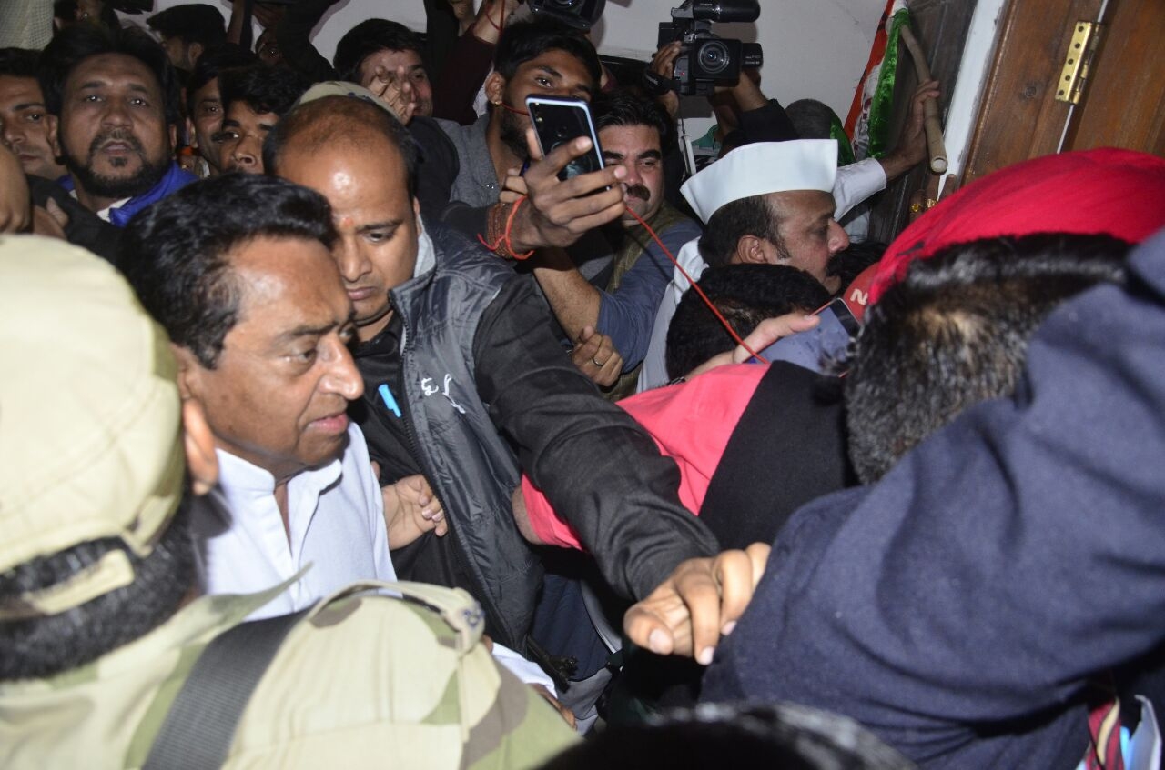 Bhopal: Madhya Pradesh Congress President Kamal Nath being greeted by party workers as he arrives at party office in Bhopal on Dec 11, 2018. He wrote a letter to Governor Anandiben Patel late on Tuesday and sought an early response from her. In his letter, he has said the Congress party as emerged as the single-largest party with majority support. The party has won 88 seats and is leading in 26 seat (at the time of publication of this picture). (Photo: IANS) by .