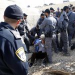 JERICHO, Oct. 15, 2018 (Xinhua) -- Israeli forces detain activists at the Palestinian Bedouin community of Khan al-Ahmar that Israel plans to demolish, located between the West Bank city of Jericho and Jerusalem, on Oct. 15, 2018. Khan al-Ahmar is a Bedouin community built without permission, according to the Israeli authorities. (Xinhua/Mamoun Wazwaz/IANS) by .