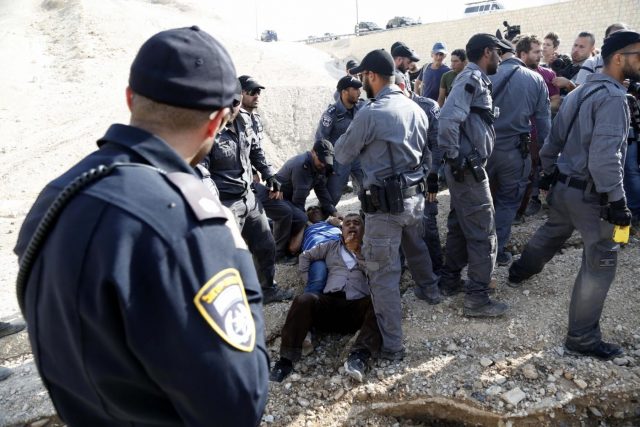 JERICHO, Oct. 15, 2018 (Xinhua) -- Israeli forces detain activists at the Palestinian Bedouin community of Khan al-Ahmar that Israel plans to demolish, located between the West Bank city of Jericho and Jerusalem, on Oct. 15, 2018. Khan al-Ahmar is a Bedouin community built without permission, according to the Israeli authorities. (Xinhua/Mamoun Wazwaz/IANS) JERICHO, Oct. 15, 2018 (Xinhua) -- Israeli forces detain activists at the Palestinian Bedouin community of Khan al-Ahmar that Israel plans to demolish, located between the West Bank city of Jericho and Jerusalem, on Oct. 15, 2018. Khan al-Ahmar is a Bedouin community built without permission, according to the Israeli authorities. (Xinhua/Mamoun Wazwaz/IANS) by .