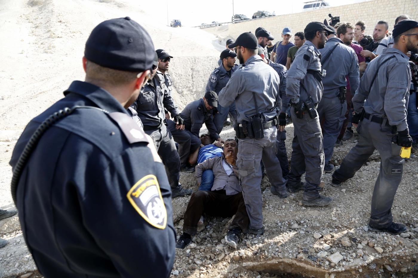 JERICHO, Oct. 15, 2018 (Xinhua) -- Israeli forces detain activists at the Palestinian Bedouin community of Khan al-Ahmar that Israel plans to demolish, located between the West Bank city of Jericho and Jerusalem, on Oct. 15, 2018. Khan al-Ahmar is a Bedouin community built without permission, according to the Israeli authorities. (Xinhua/Mamoun Wazwaz/IANS) by .