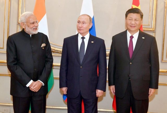 Buenos Aires: Prime Minister Narendra Modi, Russian President Vladimir Putin and Chinese President Xi Jinping at the RIC (Russia, India, China) Informal Summit, in Buenos Aires, Argentina on Nov 30, 2018. (Photo: IANS/PIB) Buenos Aires: Prime Minister Narendra Modi, Russian President Vladimir Putin and Chinese President Xi Jinping at the RIC (Russia, India, China) Informal Summit, in Buenos Aires, Argentina on Nov 30, 2018. (Photo: IANS/PIB) by .