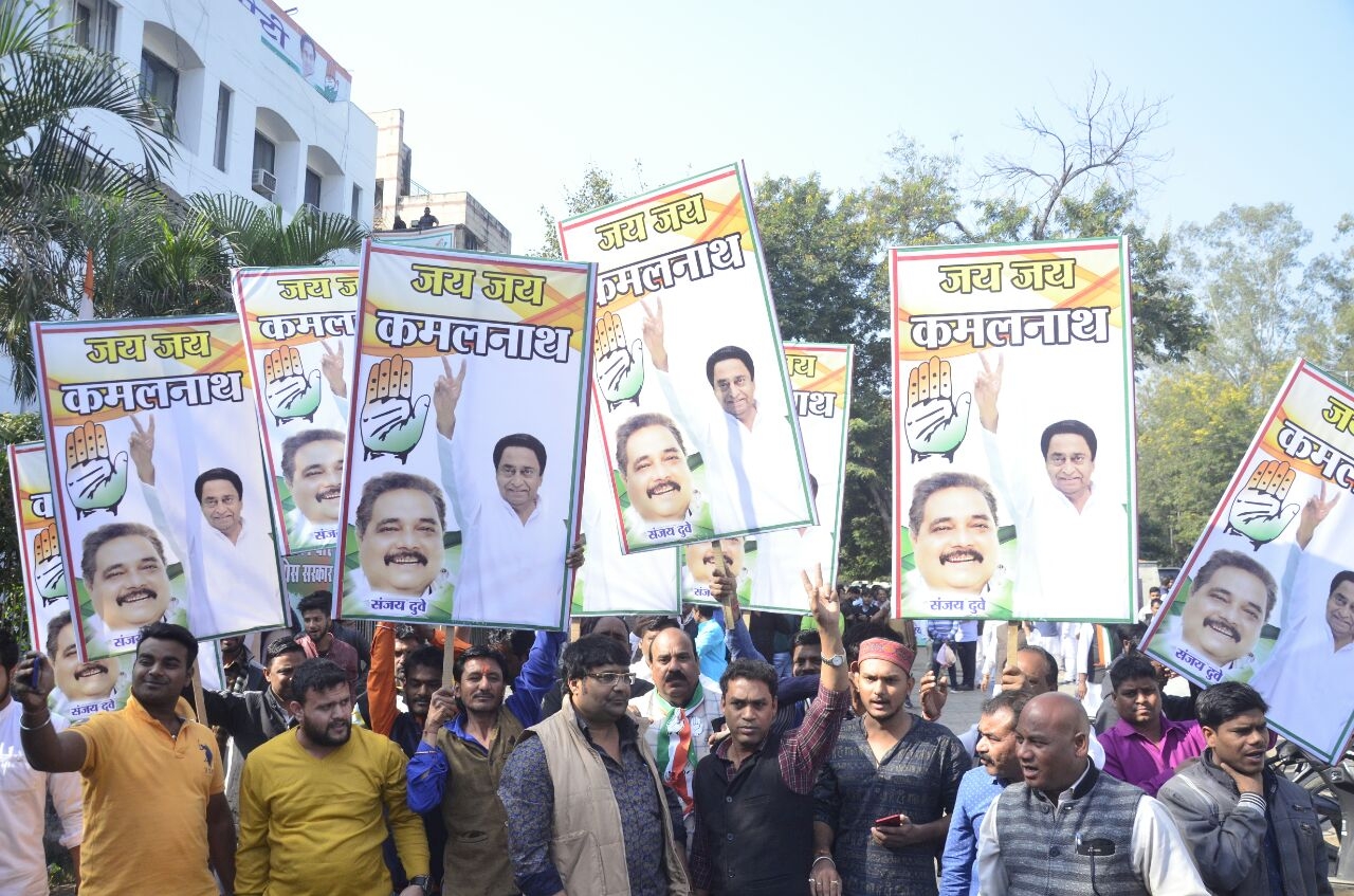 Bhopal: Congress workers celebrate party's performance in the recently concluded Madhya Pradesh Assembly polls in Bhopal on Dec 11, 2018. The party has won 88 seats and is leading in 26 seat (at the time of publication of this picture). (Photo: IANS) by .