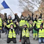 PARIS, Dec. 8, 2018 (Xinhua) -- "Yellow Vests" protesters shout slogans near the Arch of Triumph in Paris, France, on Dec. 8, 2018. Riot police fired tear gas and water cannon at "Yellow Vests" protesters marching in Paris on Saturday in the fourth week-end action despite President Emmanuel Macron's series of concessions. (Xinhua/Chen Yichen/IANS) by .