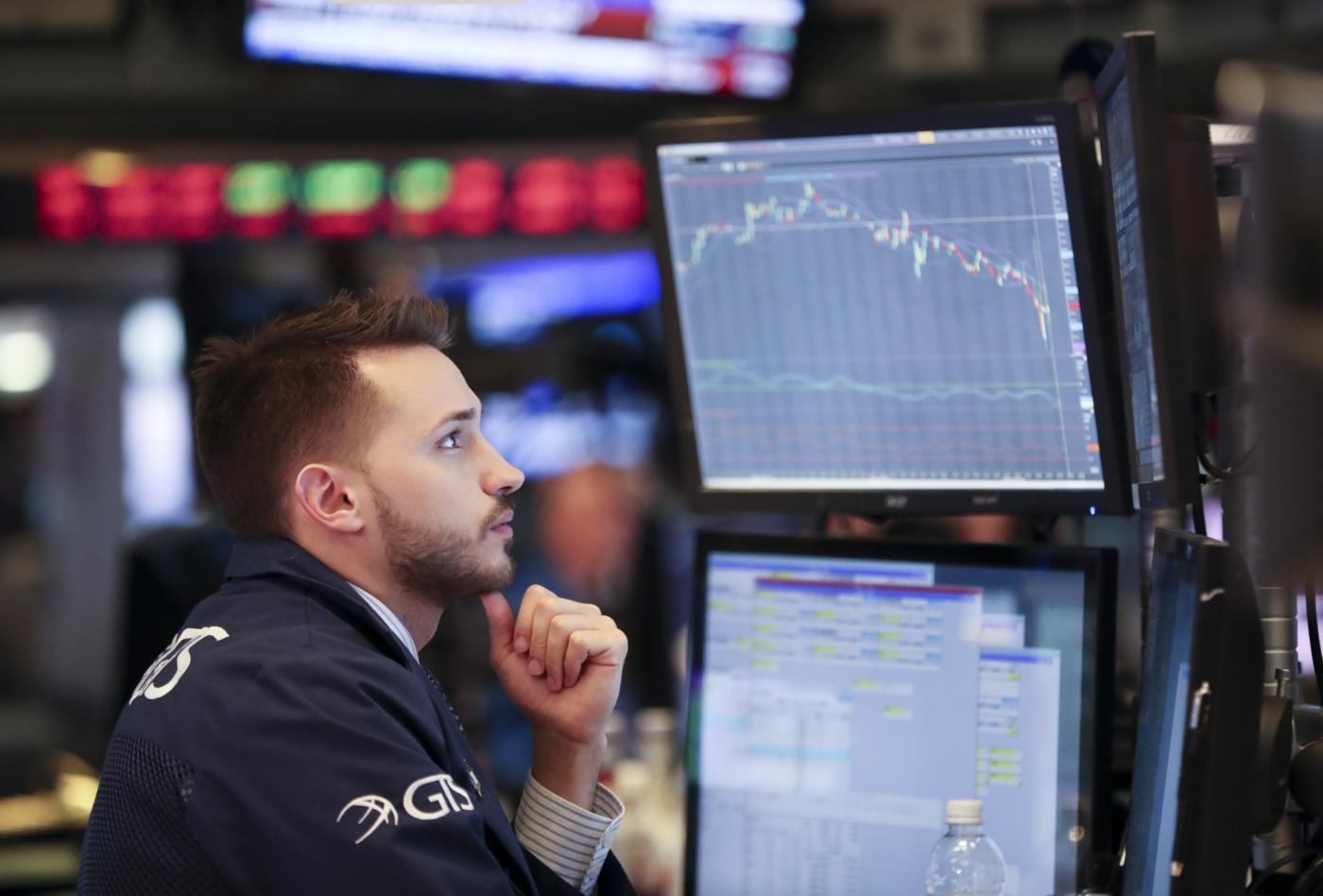 NEW YORK, Feb. 5, 2018 (Xinhua) -- A trader works at the New York Stock Exchange in New York, the United States, on Feb. 5, 2018. U.S. stocks closed sharply lower on Monday, with the Dow plummeting 4.60 percent, as the market took a heavy hit from panic sales. (Xinhua/Wang Ying/IANS) by .