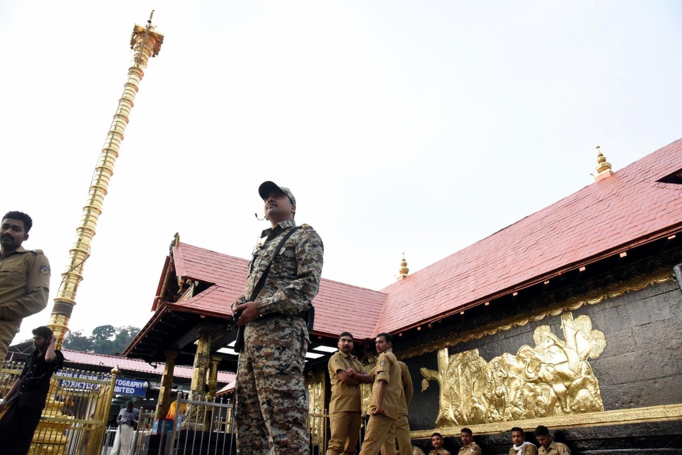 Pathanamthitta: A security personnel stands guard at the Sabarimala temple in Kerala's Pathanamthitta district on Nov 17, 2018. A Hindu group on Saturday called for a shutdown in Kerala following the "detention" of few religious leaders the previous night from the Sabarimala temple premises. The most prominent among the detained on Friday night were Hindu Iykavedi (HI) President and senior BJP leader K.P. Sasikala. She was detained while proceeding towards the Lord Ayyappa shrine. (Photo: IANS) by .