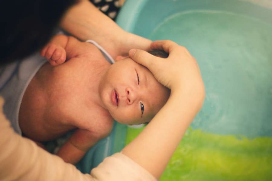 Baby bathing. by .
