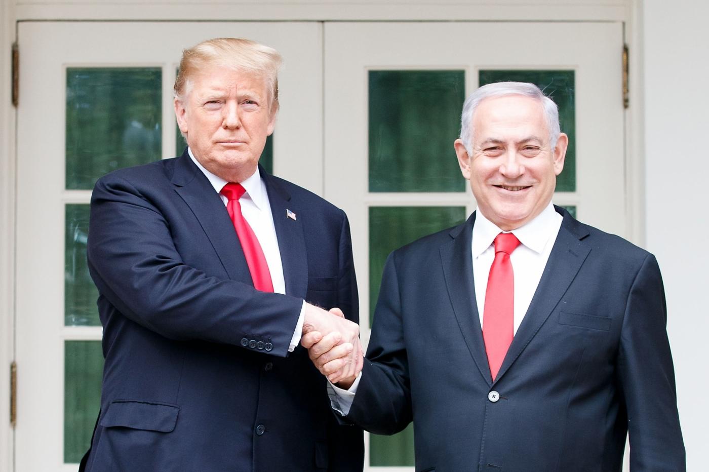WASHINGTON, March 25, 2019 (Xinhua) -- U.S. President Donald Trump (L) shakes hands with Israeli Prime Minister Benjamin Netanyahu during their meeting at the White House in Washington D.C., the United States, on March 25, 2019. U.S. President Donald Trump on Monday signed a proclamation recognizing Israel's sovereignty over the disputed Golan Heights, territory that Israel seized from Syria in 1967. (Xinhua/Ting Shen/IANS) by . 