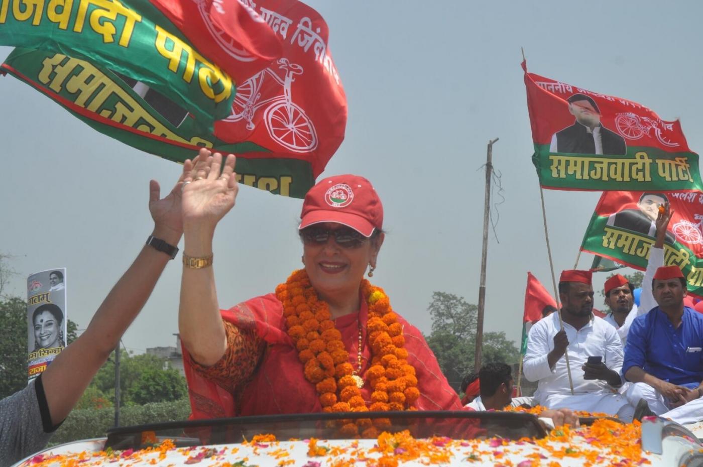 Lucknow: Samajwadi Party's Lok Sabha candidate from Lucknow, Poonam Sinha waves at supporters during a roadshow ahead of the 2019 Lok Sabha elections, in Lucknow on April 26, 2019. (Photo: IANS) by .