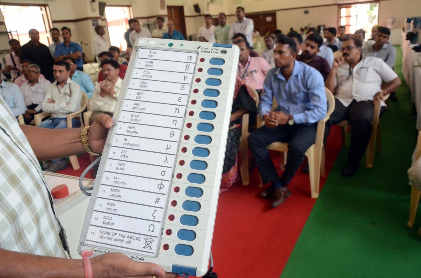Mumbai: Election officials demonstrate the functioning of an Electronic Voting Machine (EVM) and Voter Verified Paper Audit Trail (VVPAT) ahead of 2019 Lok Sabha polls during a voter awareness programme in Mumbai, on April 10, 2019. (Photo: IANS) by .