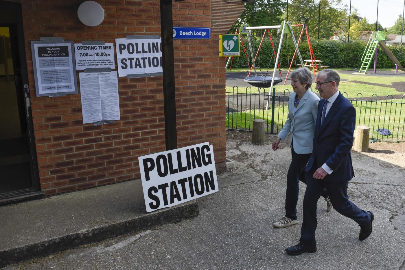 SONNING (BRITAIN), May 23, 2019 (Xinhua) -- British Prime Minister Theresa May (L) arrives to vote at a polling station in Sonning, Britain, on May 23, 2019. Voters across Britain cast their ballots on Thursday for the European Parliament elections as it is widely forecast that Brexit Party will take a lead. (Xinhua/Stephen Chung/IANS) by Stephen Chung.