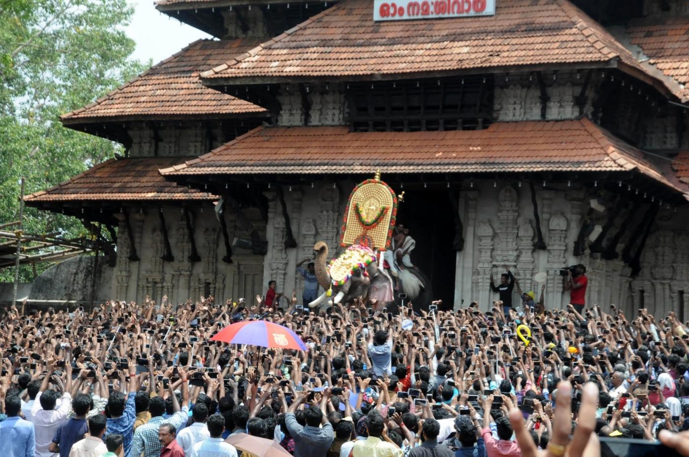 Thrissur: Elephant "Thechikottukavu Ramachandran" opens the door of the southern gopuram of the Vadakkumnathan temple to formally announce the beginning of the Thrissur Pooram in Kerala's Thrissur on May 4, 2017. (Photo: IANS) by .