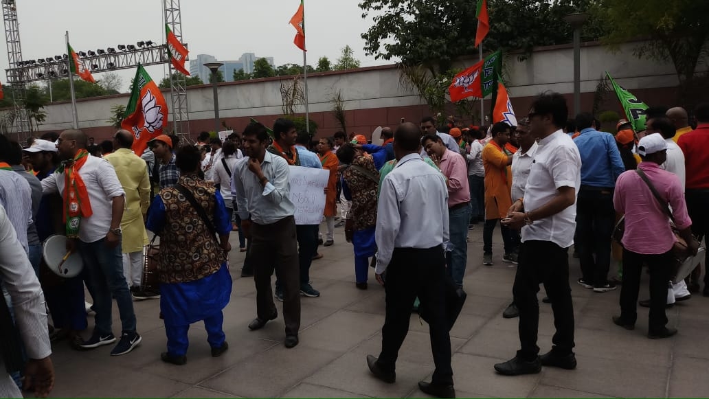 New Delhi: BJP supporters seen celebrating at the party's headquarters after the counting trends show that the party appeared set to retain power as its candidates led in most of the 542 Lok Sabha constituencies, in New Delhi on May 23, 2019. (Photo: IANS) by .