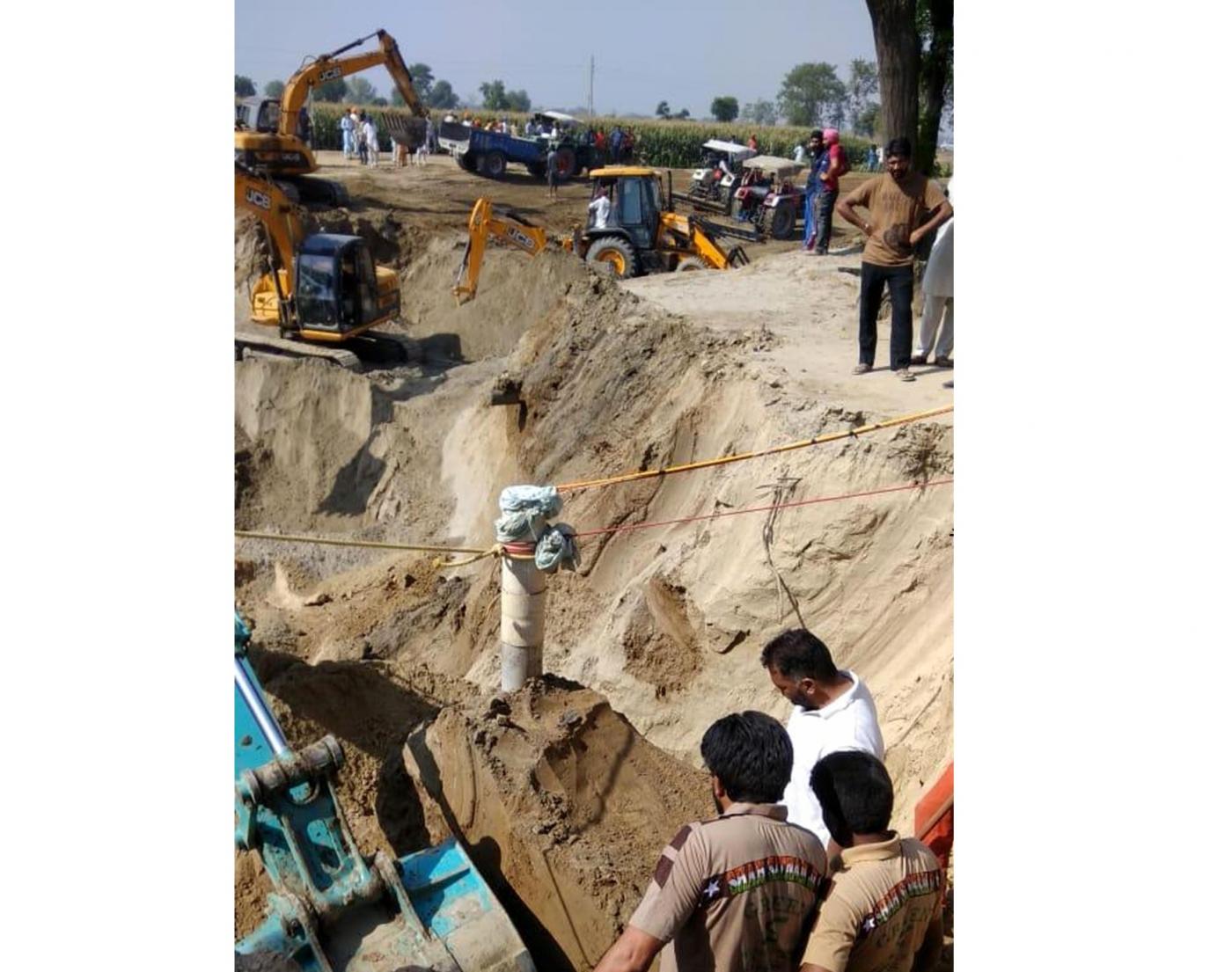 Sangrur: Rescue operations underway to rescue a two-year-old boy who fell into a 150-foot narrow abandoned borewell in a village in Punjab's Sangrur district over 24 hours ago, on June 7, 2019. (Photo: IANS) by .