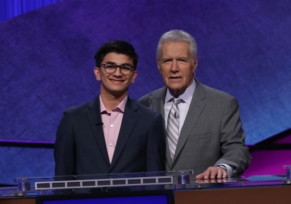 Avi Gupta, left, who won the $100,000 Teen Jeopardy quiz show contest prize, left, with the programme's quiz-master Alex Trebek. (Photo: Jeopardy Productions) by .