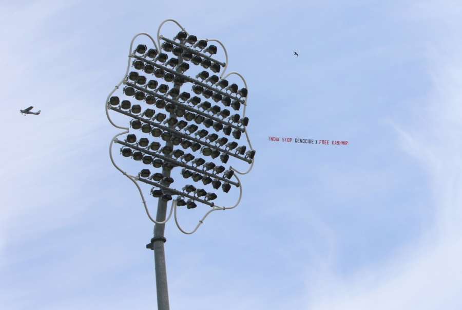Leeds: A low flying airplane tows a large aerial banner reading "India Stop Genocide & Free Kashmir" in the skies above the Headingley Stadium where the 44th match of World Cup 2019 between India and Sri Lanka is underway in Leeds, England on July 6, 2019. (Photo: Surjeet Yadav/IANS) by .