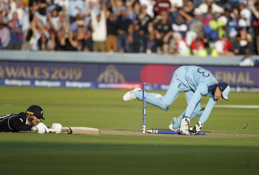 London: England's Jos Buttler dismisses Martin Guptill in the last ball of the super over to win the 2019 World Cup at Lord's Cricket Ground in London on July 15, 2019. (Photo: Surjeet Yadav/IANS) by .