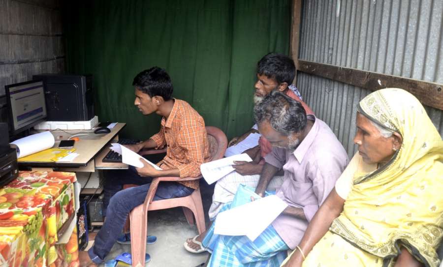 Morigaon: People check their names after the final list of National Register of Citizens (NRC) of Assam was published, at a computer centre in Morigaon on Aug 31, 2019. (Photo: IANS) by .
