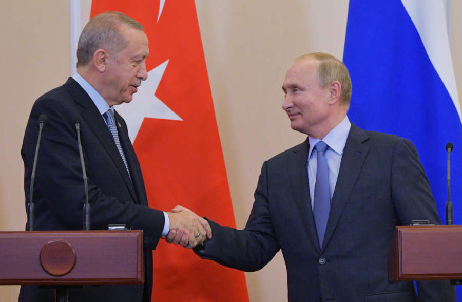 SOCHI (RUSSIA), Oct. 22, 2019 (Xinhua) -- Russian President Vladimir Putin (R) shakes hands with Turkish President Recep Tayyip Erdogan during a joint news conference following their meeting in Sochi, Russia, on Oct. 22, 2019. Russia and Turkey have adopted a joint memorandum on the situation in Syria after the talks between Russian President Vladimir Putin and his Turkish counterpart Recep Tayyip Erdogan in Sochi. According to the memorandum, Moscow and Ankara have agreed to deploy Russian and Syrian forces in zone of the Turkish operation in Syria starting from Wednesday. (Sputnik via Xinhua/IANS) by .