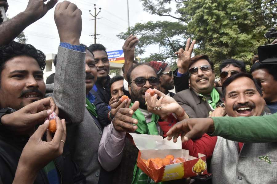 Ranchi: Jharkhand Mukti Morcha (JMM) workers celebrate the party's performance in the state assembly elections as counting is underway, in Ranchi on Dec 23, 2019. The grand alliance of the JMM-Cong-RJD has managed to take early lead over the BJP in Jharkhand Assembly elections as per the early trends and is likely to form the next government in the mineral rich state. (Photo: IANS) by .