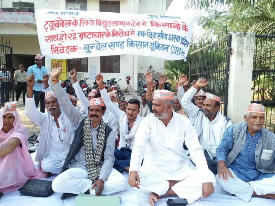Farmers under the banner of Bundelkhand Kisan Union, stage a sit-in demonstration against corruption. by .