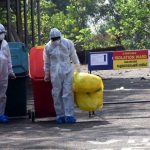 Kochi: Medical staff wearing protective gear, take medical waste to dump it as they exit the Special Isolation Ward set up to provide treatment to novel coronavirus patients at Kochi Medical college, in Kerala on Feb 8, 2020. (Photo: IANS) by .