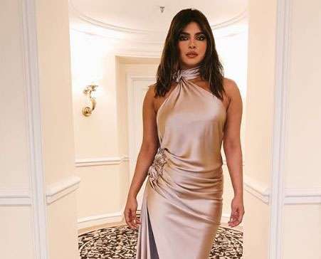 Actress Priyanka Chopra Jonas on Sunday shared her pre-Grammys' party look. Wearing a champagne satin backless gown, Priyanka is definitely leaving her fans in awe of her fashion statement. by .