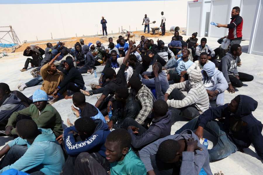 TRIPOLI, May 23, 2017 (Xinhua) -- Illegal migrants from Africa sit at a gathering point after being rescued by Libyan coast guards off the coastal town of Tajoura, 15 kilometres east of the capital Tripoli on May 23, 2017. (Xinhua/Hamza Turkia/IANS) (lrz) by .