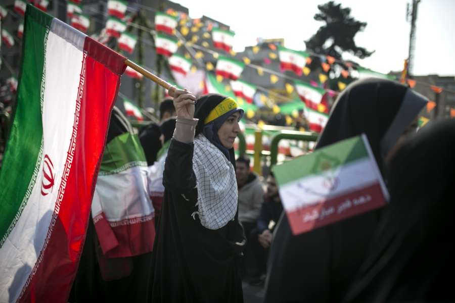 TEHRAN, Feb. 11, 2018 (Xinhua) -- A woman waves an Iranian national flag at a rally to mark the victory of the Islamic revolution at Azadi (liberty) Square in Tehran, Iran, on Feb. 11, 2018. Hundreds of thousands of Iranians on Sunday celebrated nationwide the 39th anniversary of the victory of the Islamic revolution in 1979. (Xinhua/Ahmad Halabisaz/IANS) by .