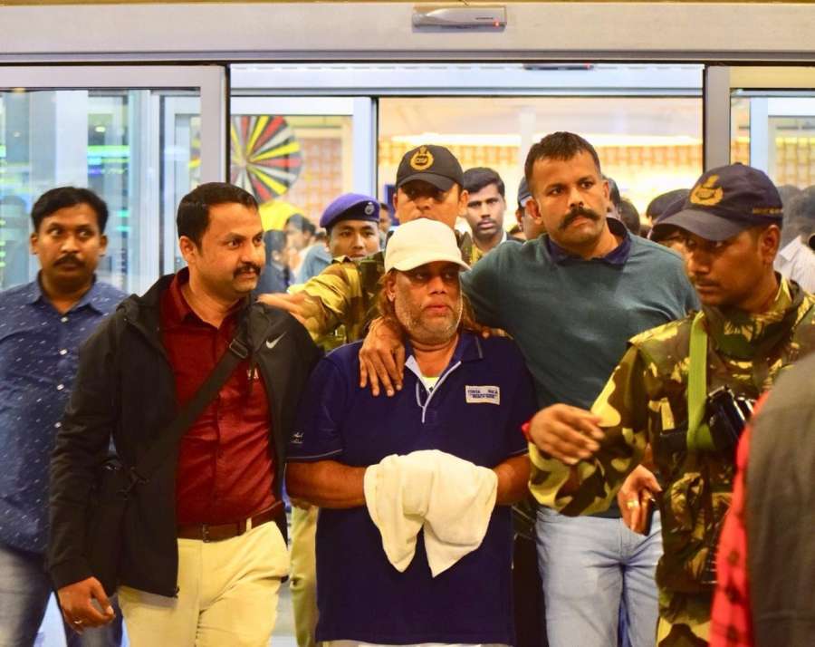 Bengaluru: Ravi Pujari (wearing white cap), accused of committing serious offences including murder and extortion, reaches Kempegowda International Airport. by .