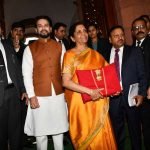 New Delhi: Union Finance and Corporate Affairs Minister Nirmala Sitharaman carrying budget papers wrapped in a red cloth, accompanied by Union MoS Finance and Corporate Affairs Anurag Thakur and other officials of the Finance Ministry, leaves for the Parliament to present the Union Budget 2020-2021, in New Delhi on Feb 1, 2020. (Photo: IANS) by .