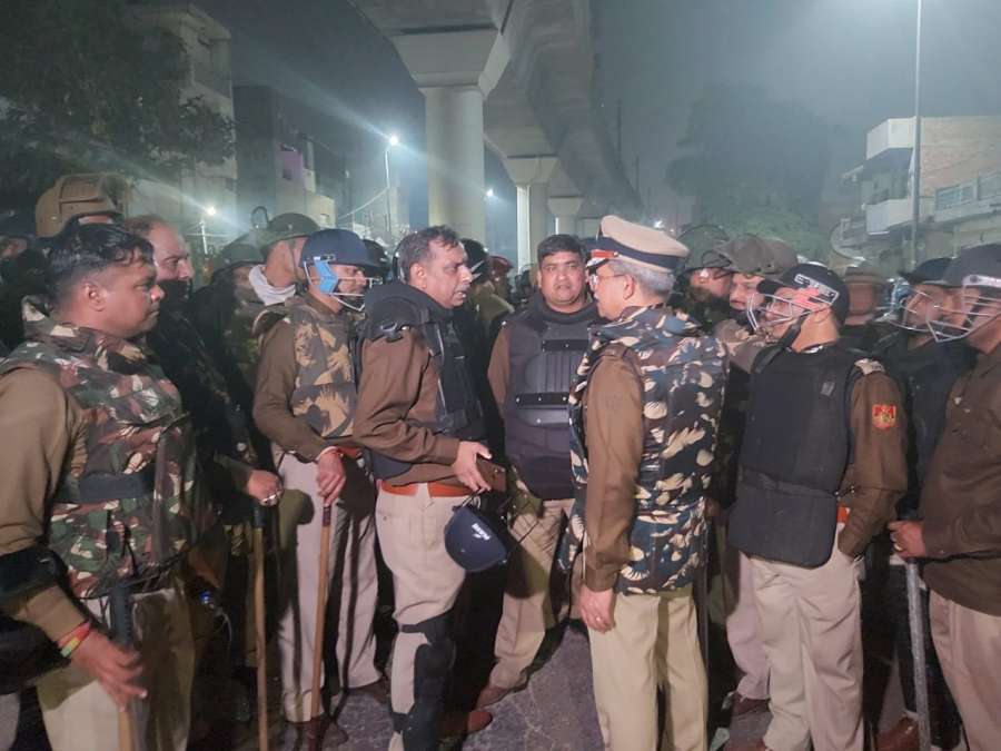 New Delhi: Delhi Police personnel conducts flag march after the violence in Maujpur and Jafrabad in New Delhi on Feb 24, 2020. (Photo: IANS) by .