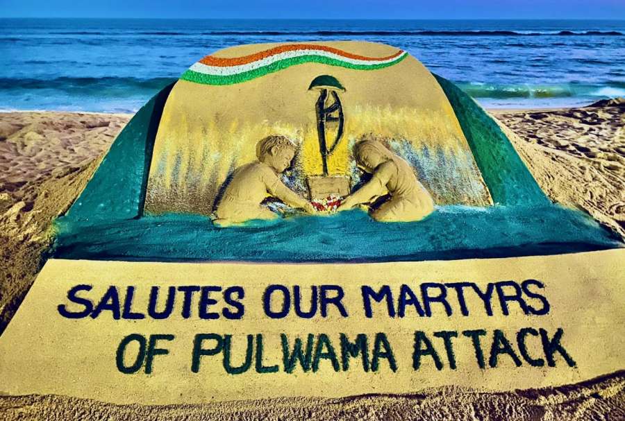 Puri: Sand artist Sudarsan Pattnaik pays tributes to the 40 CRPF soldiers who were martyred in a terror blast in Kashmir's Pulwama on this day a year ago, through his sand art at Puri beach in Odisha's Puri district on Feb 14, 2020. (Photo: IANS) by .