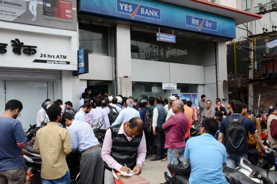 Patna: People queue up Yes Bank to withdraw cash in Patna on March 7, 2020. (Photo: IANS) by .