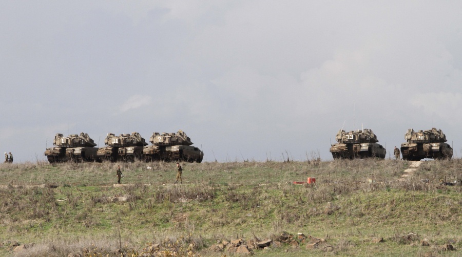 GOLAN HEIGHTS, Dec. 31, 2019 (Xinhua) -- Israeli soldiers and military tanks are seen in the Israeli-occupied Golan Heights during a military drill on Dec. 30, 2019. The Israeli military was in a state of high alert in the Golan Heights, in readiness for possible retaliation by Iran after U.S. strikes on Kata'ib Hezbollah facilities in Iraq and Syria Sunday. (Photo by Gil Cohen Magen/Xinhua/IANS) by .