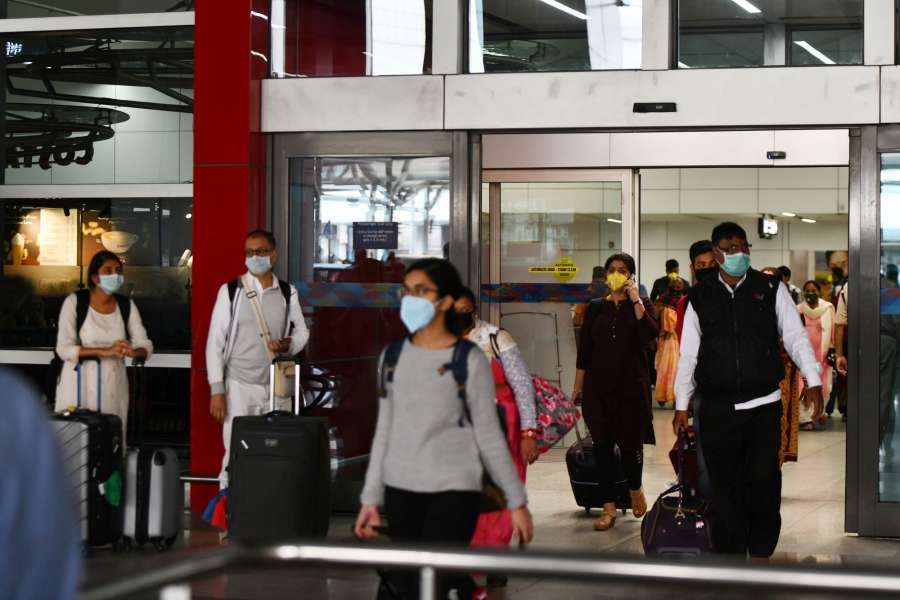 New Delhi: Passengers seen wearing masks as a precautionary measure against COVID-19 (Coronavirus) at the Indira Gandhi International Airport in New Delhi on March 15, 2020. (Photo: IANS) by .