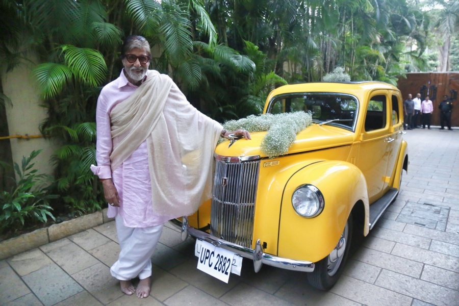Megastar Amitabh Bachchan shared a photograph of himself posing with his latest possession -- a new lemon coloured vintage car. An ecstatic Big B looked posed with his Ford. by .