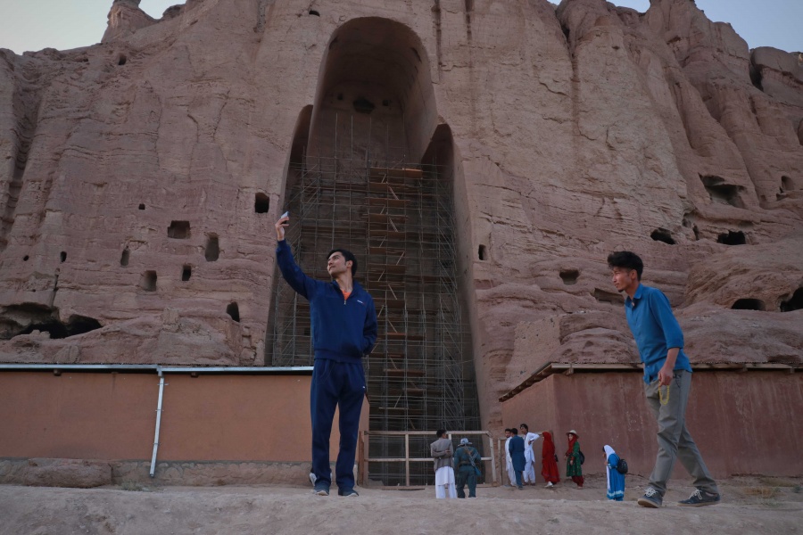 BAMYAN, Aug. 17, 2019 (Xinhua) -- A tourist takes selfies in front of the ruined Buddha statue in Bamyan province, Afghanistan, Aug. 16, 2019. (Photo by Noor Azizi/Xinhua/IANS) by .