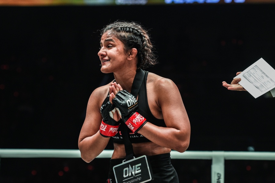 Beijing: India's Ritu Phogat, who made her debut in mixed martial arts (MMA), celebrates after winning against South Africa's Kim Nam-hee at One Championship's Age of Dragons in Beijing on Nov 16, 2019. (Photo: IANS) by .