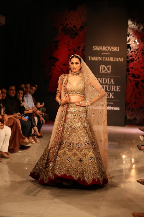 New Delhi: A model showcases fashion designer Tarun Tahiliani's creations at the India Couture Week 2019 in New Delhi, on July 28, 2019. (Photo: Amlan Paliwal/IANS) by .