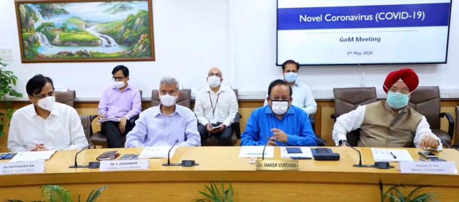 New Delhi: Union Health Minister Harsh Vardhan chairs a high-level meeting of the Group of Ministers to review, monitor and evaluate the preparedness and measures taken to tackle COVID-19 pademic during the extended nationwide lockdown imposed to mitigate the spread of coronavirus, in New Delhi on May 5, 2020. The meeting was attended by Union Ministers Ashwini Kumar Choubey, Nityanand Rai, S. Jaishankar and Hardeep Singh Puri; Chief of Defence Staff (CDS) Gen. Bipin Rawat and Health Secretary Preeti Sudan. (Photo: IANS/PIB) by .