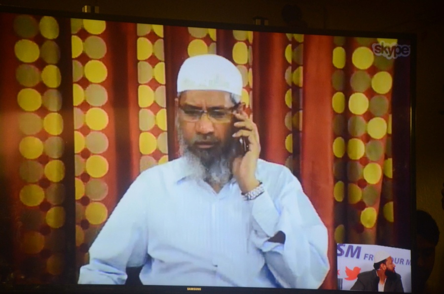 Mumbai: Controversial Islamic preacher Zakir Naik addresses a press conference through Skype in Mumbai, on July 15, 2016. (Photo: IANS) by .