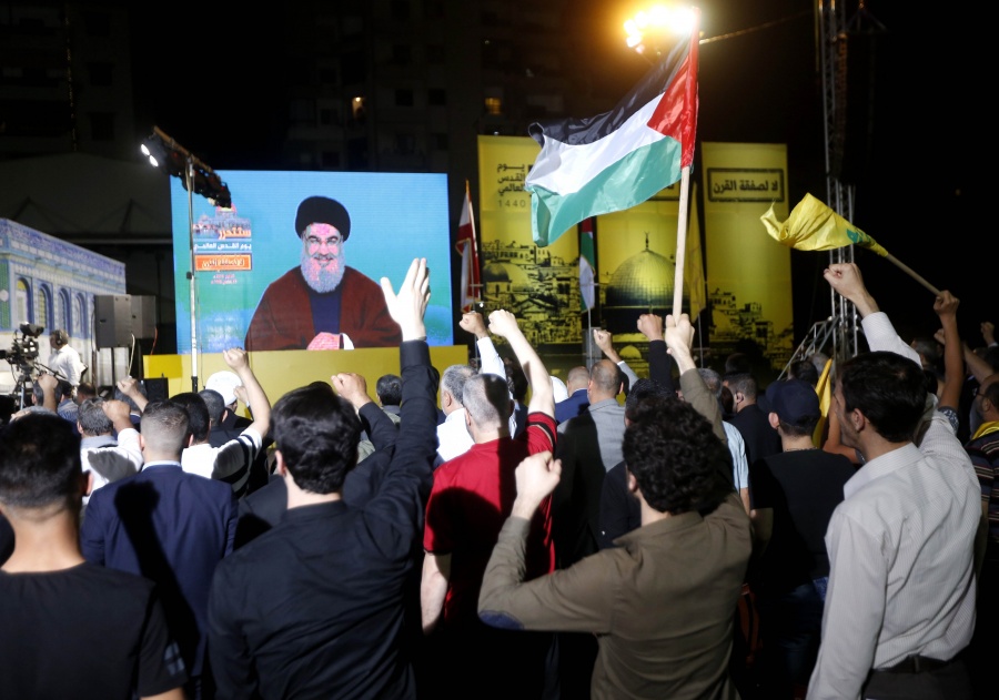 BEIRUT, May 31, 2019 (Xinhua) -- Supporters listen to Hezbollah leader Sayyed Hassan Nasrallah's speech on a screen during a rally in the southern suburb of Beirut, Lebanon, on May 31, 2019. Hezbollah leader Sayyed Hassan Nasrallah on Friday vowed to fight fiercely against U.S. President Donald Trump's plan, known as the Deal of the Century, NBN local TV Channel reported. "This deal is a shame and it should be confronted by everybody. We are capable of facing this conspiracy," Nasrallah said in a televised speech marking al-Quds Day, an occasion to express support for the Palestinians. (Xinhua/Bilal Jawich/IANS) by .