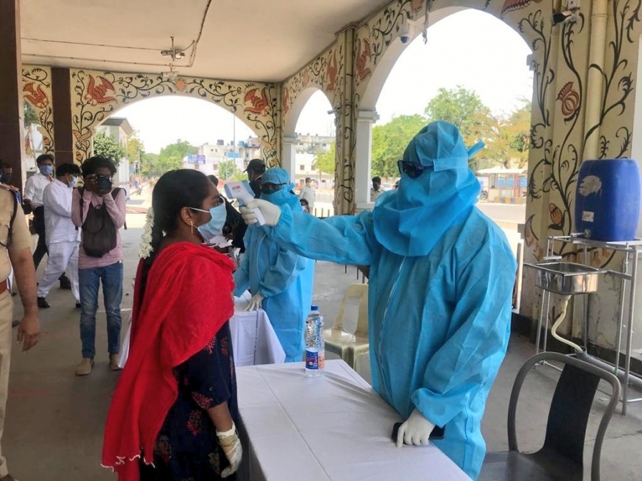 Hyderabad: Passengers headed for Chennai being screened for COVID-19 as they arrive at Vijayawada railway station to board the New Delhi to Chennai Central special train during the extended nationwide lockdown imposed to mitigate the spread of coronavirus, on May 14, 2020. (Photo: IANS) by . 