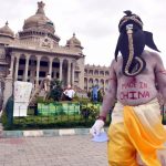 Bengaluru: Artiste Paramesh Jolad dressed up as Lord Ganesha spreads awareness urging people to boycott Chinese products and use only domestic products, in front of Vidhana Soudha in Bengaluru on June 13, 2020. (Photo: IANS) by .