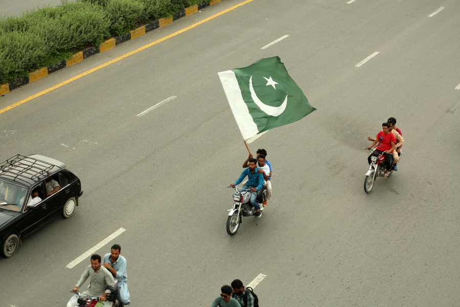 ISLAMABAD, Aug. 14, 2019 (Xinhua) -- A Pakistani man on a motorcycle holds a national flag during the Independence Day celebrations in Islamabad, Pakistan, on Aug. 14, 2019. Pakistan got independence from the British colonial rule on Aug. 14, 1947. (Xinhua/Ahmad Kamal/IANS) by .