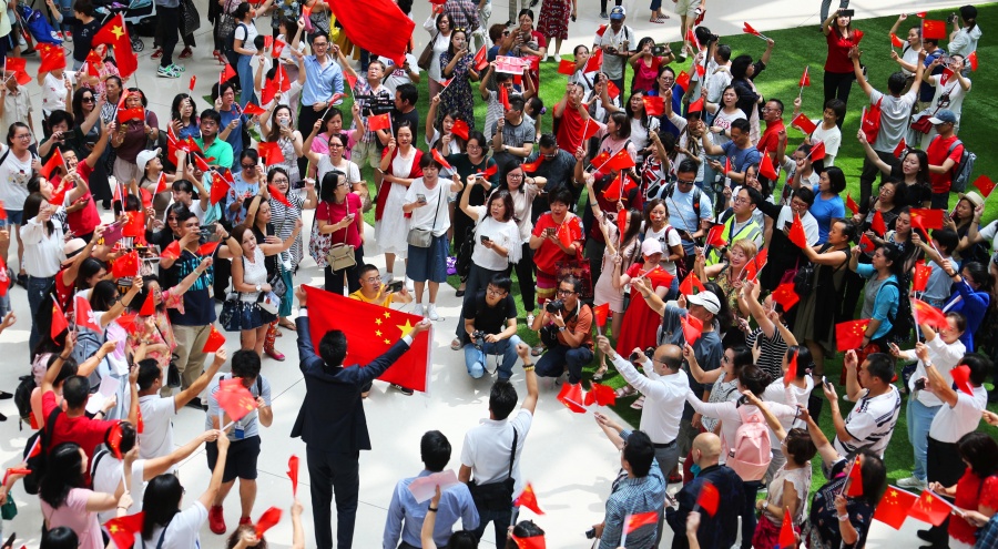 HONG KONG, Sept. 13, 2019 (Xinhua) -- People participate in a flash mob at Olympian City in Hong Kong, south China, Sept. 13, 2019. People chorused the Chinese national anthem during a flash mob in Hong Kong to celebrate the Mid-Autumn Festival on Friday. (Xinhua/Lu Ye/IANS) by .